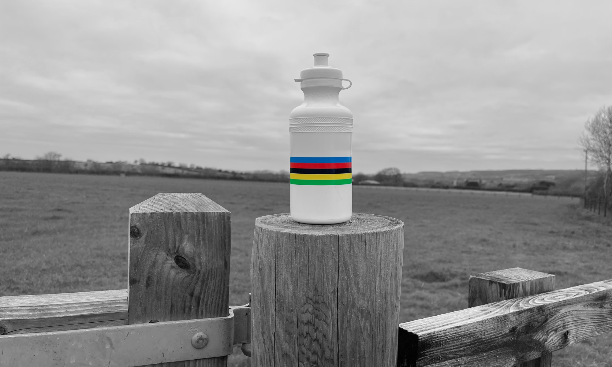 colour rainbow stripes on a black and white bidon